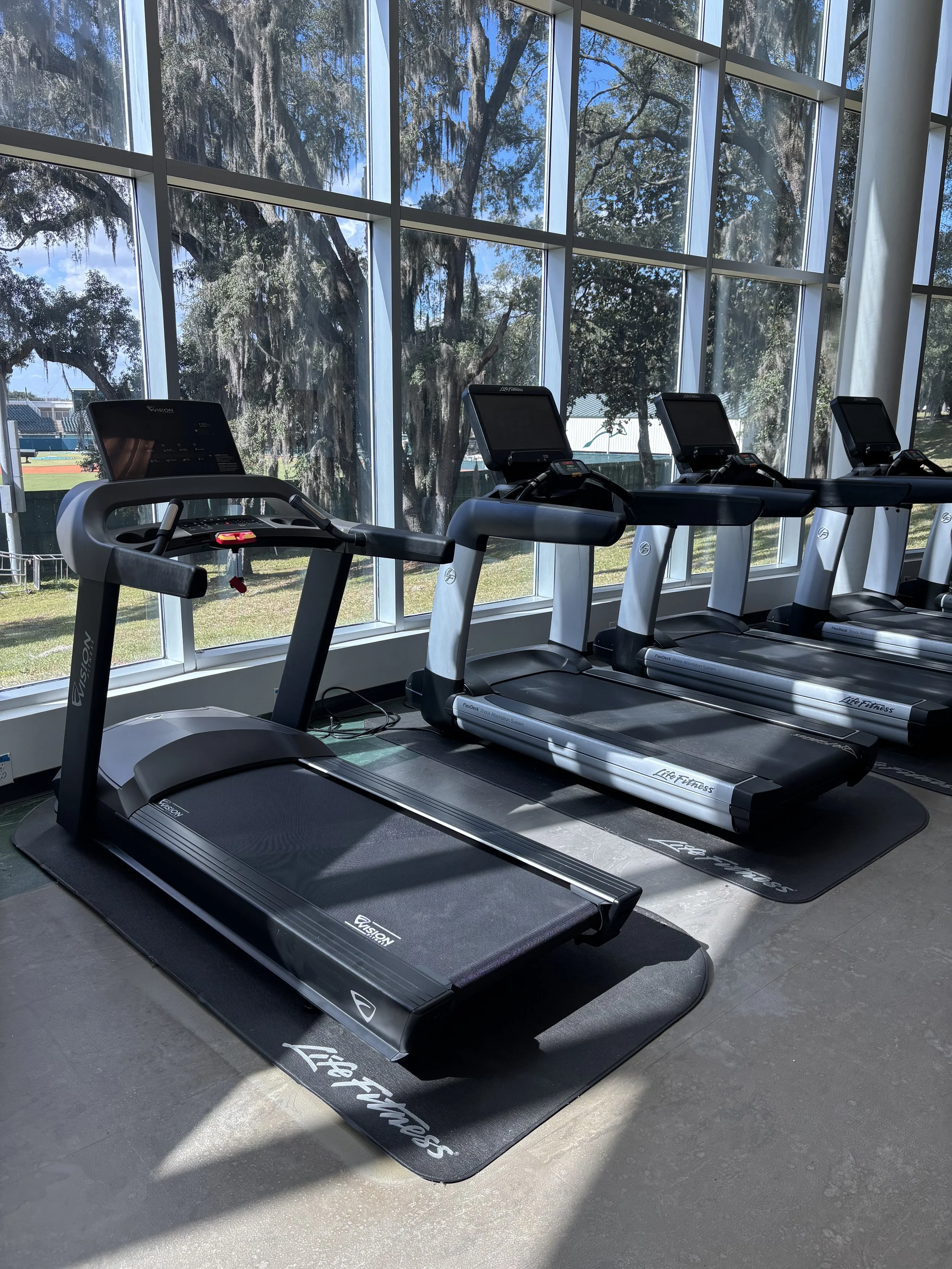 Row of commercial Life Fitness treadmills serviced in Jacksonville, FL