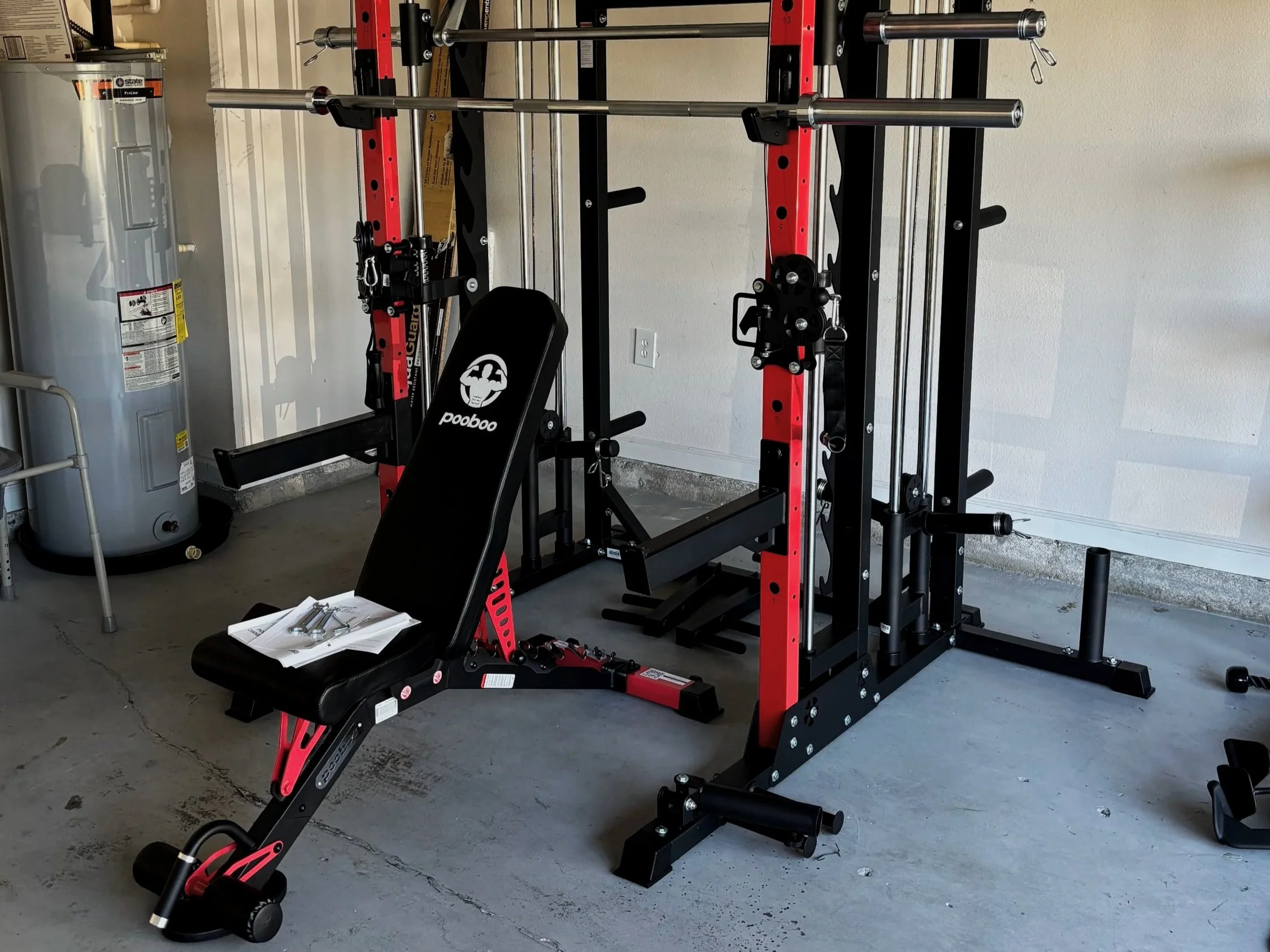 Home gym Smith machine and bench set up in a Jacksonville, FL garage