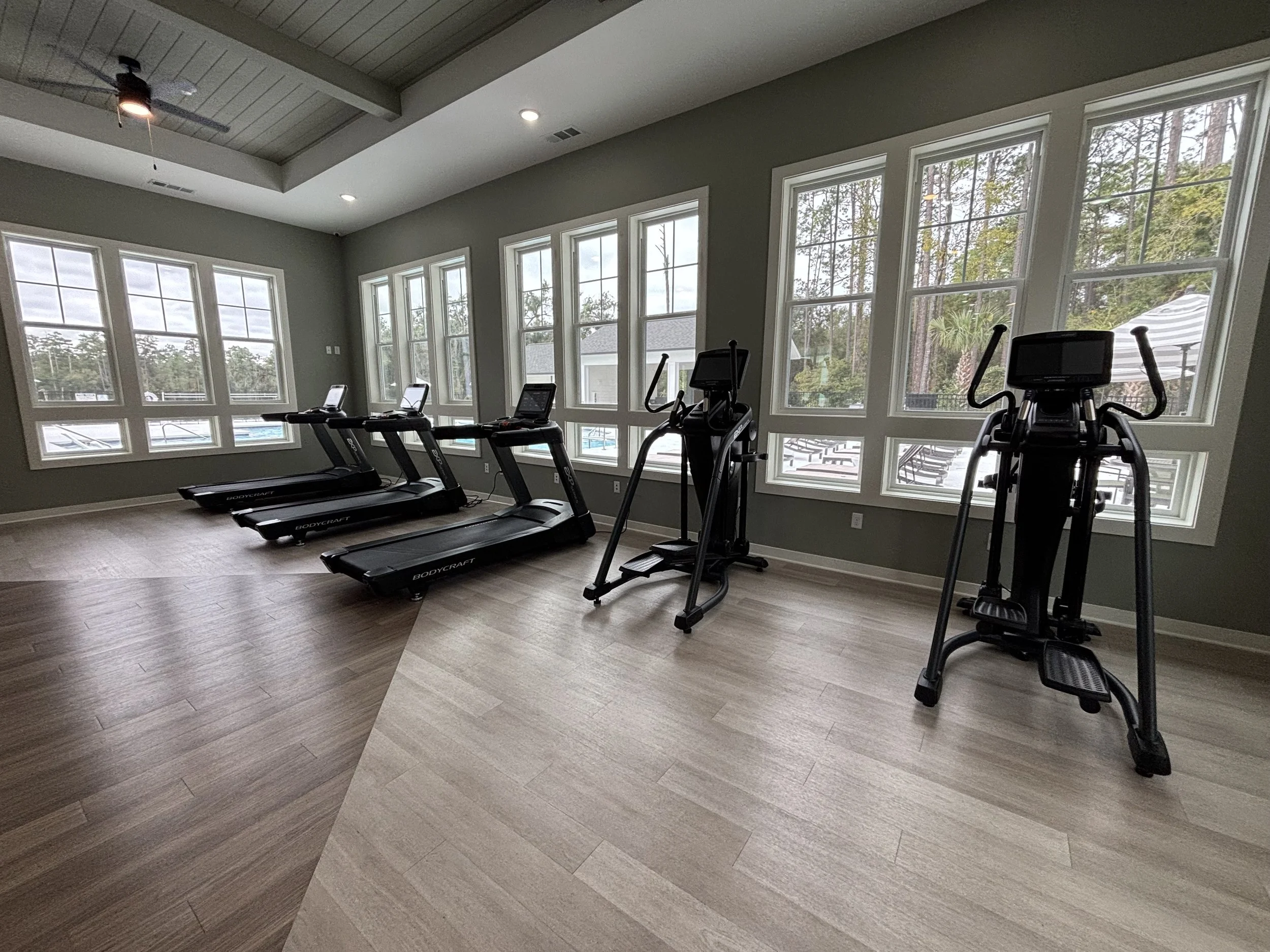 Treadmills and ellipticals in a Jacksonville, FL fitness room